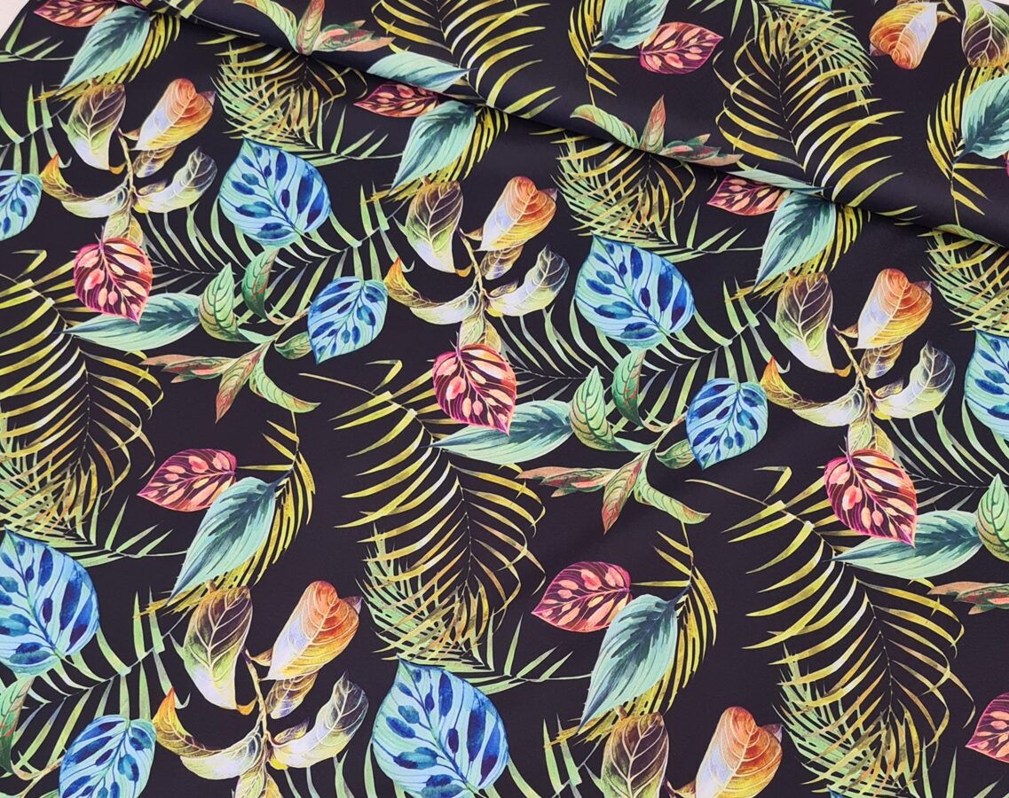 Black fabric with bright coloured palm leaves