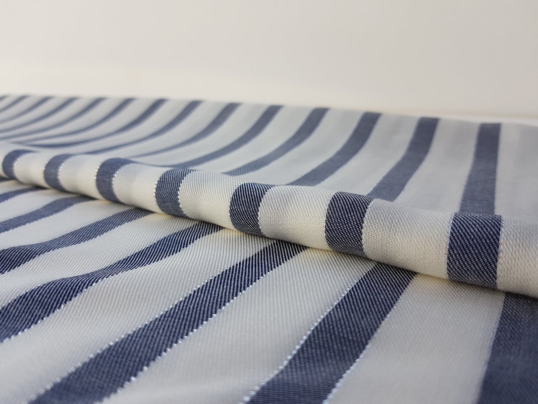 White viscose with blue vertical  stripes, decorated with  lurex thread. 