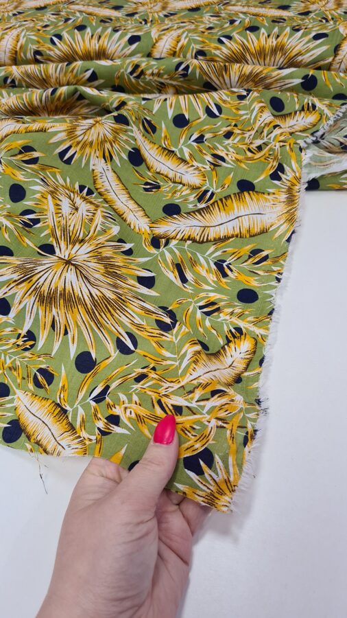 Lime green cotton / viscose fabric with palm leaves and dots print