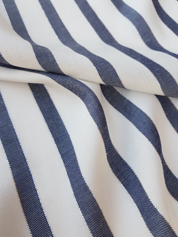 White viscose with blue vertical  stripes, decorated with  lurex thread. 